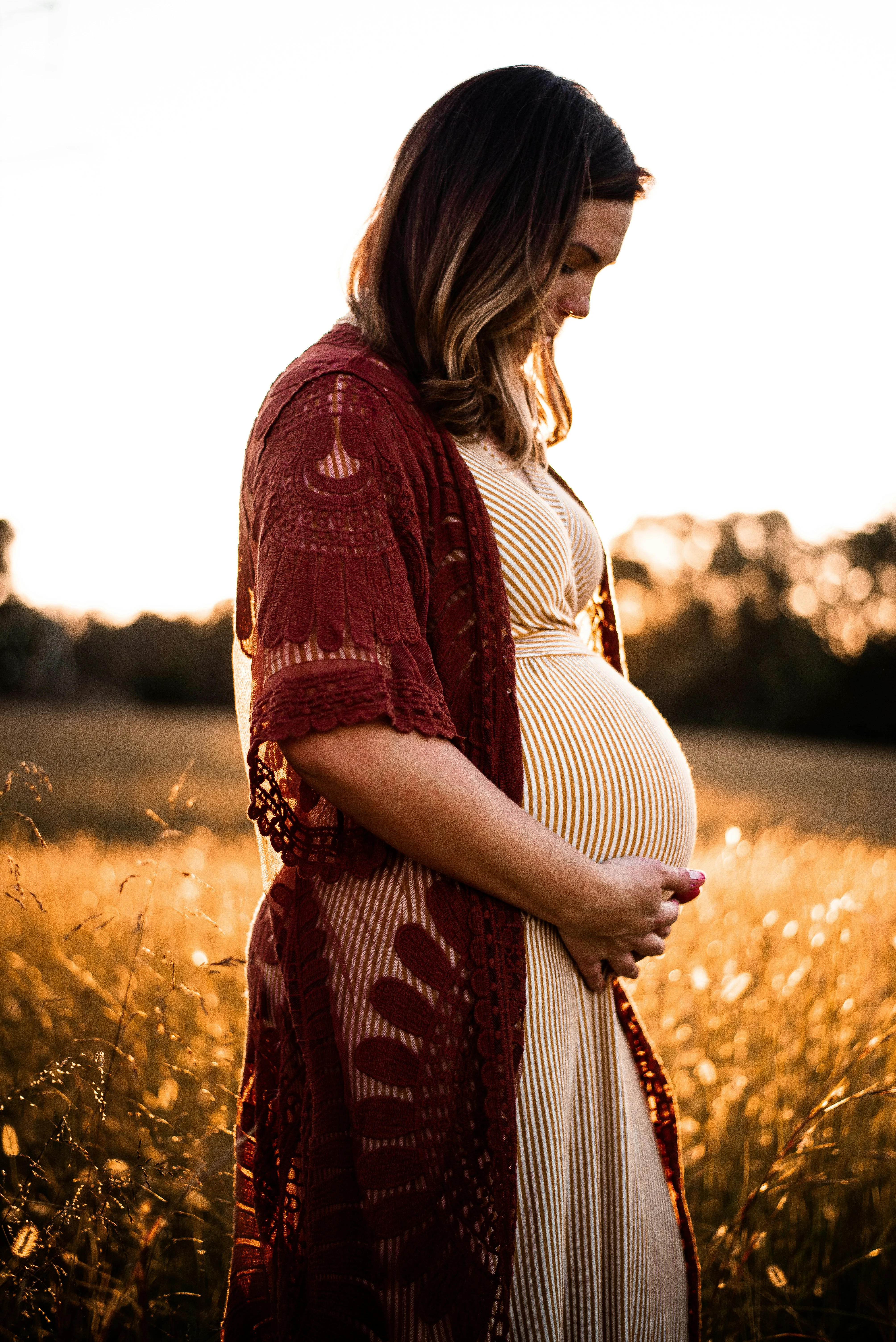 pregnant woman holding her belly